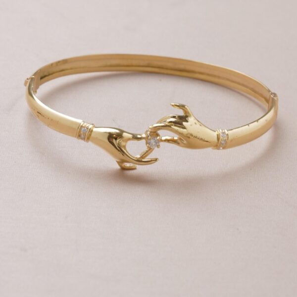 Pulsera de manos con diamantes en oro 18k