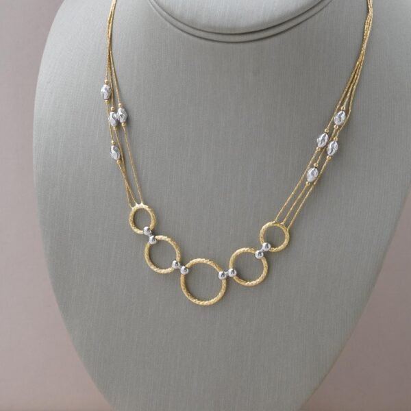 Collar de circulos en oro amarillo y oro blanco