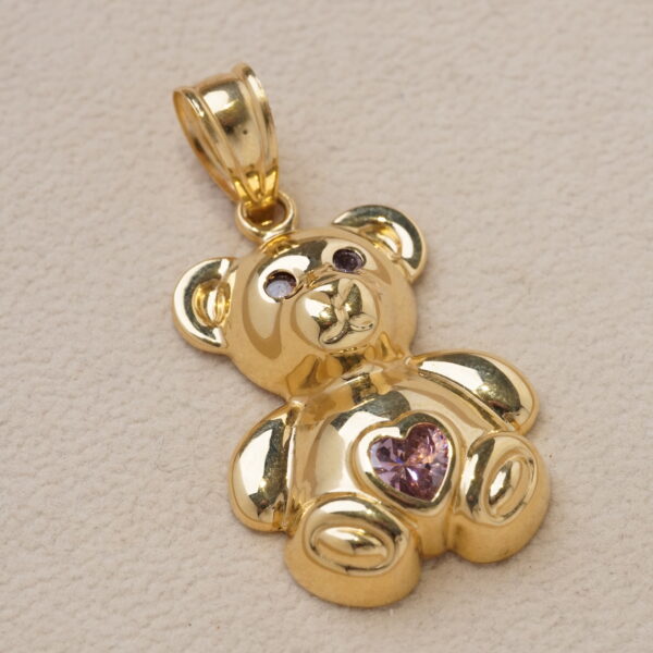 Oso en oro amarillo con corazón central